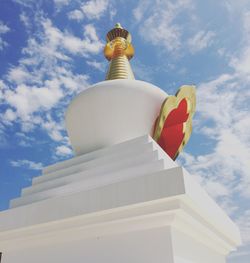 Low angle view of statue against cloudy sky