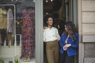 Woman standing against door