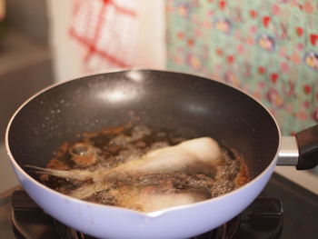 High angle view of meat in cooking pan