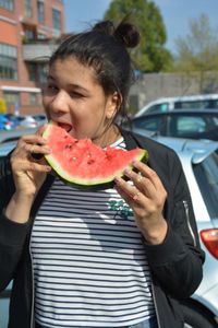 Midsection of woman eating food