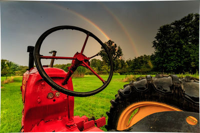 Bicycle on field against sky
