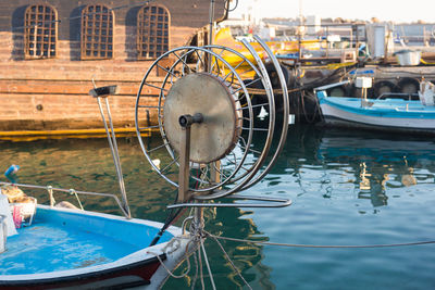 Close-up of boat moored in lake