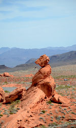 Rock formations on landscape against sky