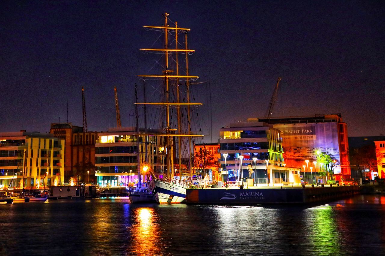 night, water, architecture, nautical vessel, transportation, illuminated, mode of transportation, building exterior, evening, built structure, ship, cityscape, vehicle, city, boat, dusk, reflection, sky, no people, nature, watercraft, harbor, waterfront, sea, building, sailboat, travel destinations, outdoors, sailing, dock, waterway, skyline