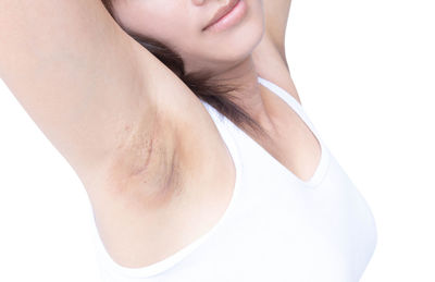 Close-up of woman against white background