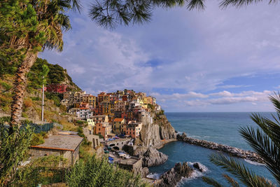 Panoramic view of townscape by sea against sky