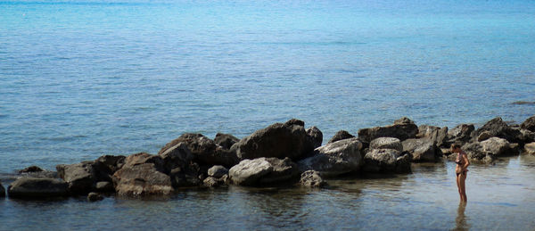 High angle view of rocks in sea