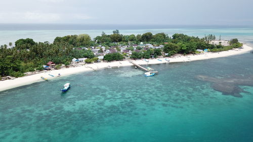 High angle view of trees by sea against sky