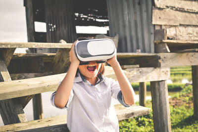 Boy using virtual reality simulator