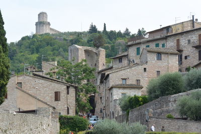 Buildings in town against clear sky