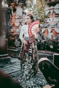 Full length of woman in traditional clothing standing outdoors