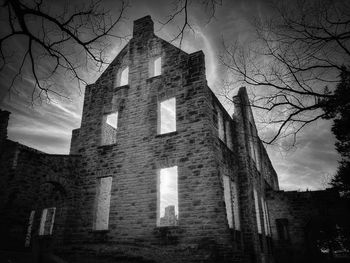 Low angle view of old building against sky