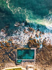 High angle view of swimming pool by sea 