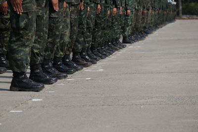 Low section of people walking on street