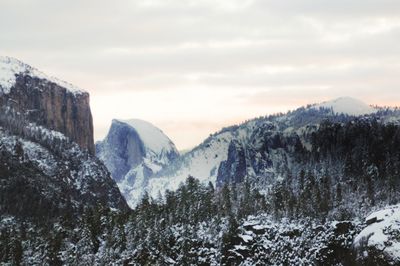 Scenic view of mountains against sky during winter