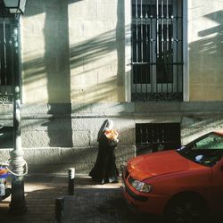 Woman standing in front of building