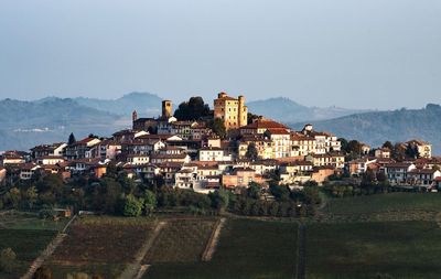 Buildings in town against clear sky