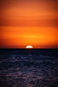 Scenic view of sea against dramatic sky