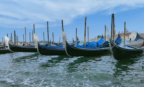 Boats in sea against sky