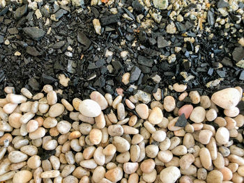 High angle view of stones on pebbles