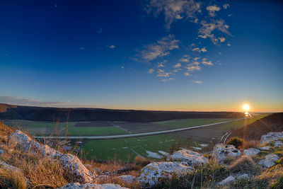 Scenic view of field against sky