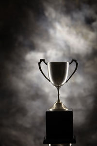 Close-up of trophy on against black background