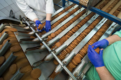 Midsection of man working at workshop