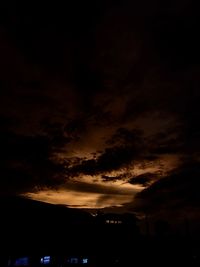 Silhouette of building at sunset