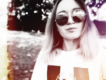 Portrait of young woman wearing sunglasses