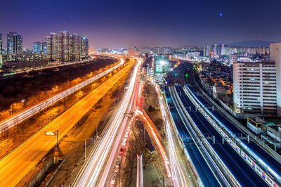 High angle view of light trails on city street at night