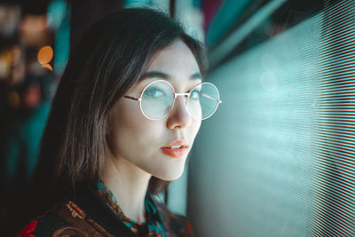 Portrait of a young woman looking away