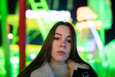 Portrait of young woman looking away outdoors