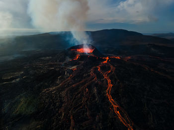 Scenic view of volcano against sky during sunset