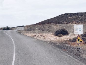 Road on landscape against sky