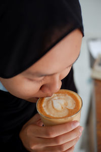 Woman drinking latte