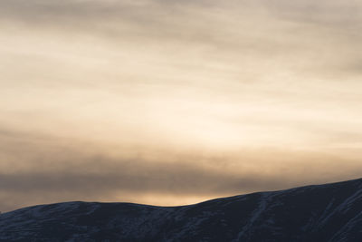 Scenic view of mountains against sky during sunset