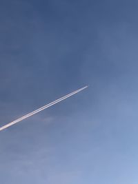 Low angle view of vapor trail in sky