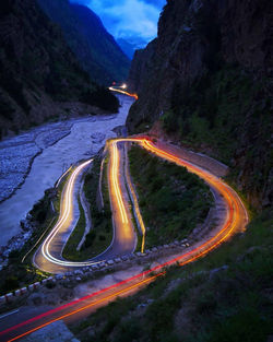 High angle view of light trails on road at night