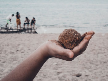 Midsection of people on beach