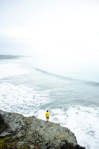 Man looking at sea against sky