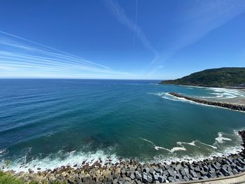 Scenic view of sea against blue sky