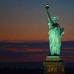 Statue of liberty against sky at twilight
