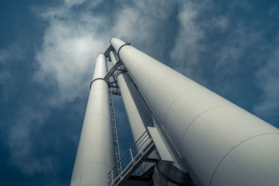 Low angle view of factory against sky