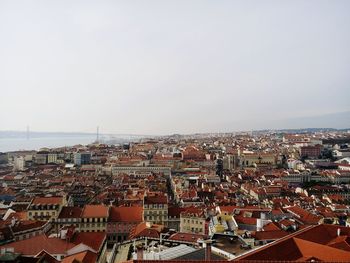 Aerial view of cityscape against clear sky