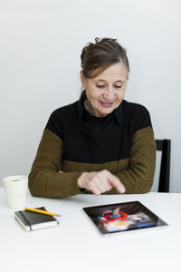 Senior woman using digital tablet