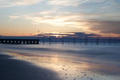 Scenic view of sea at sunset