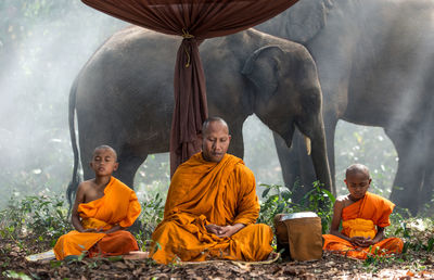 Group of people sitting in temple