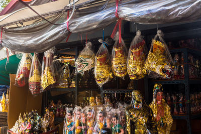 People at market stall for sale