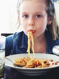 Close-up of woman eating food