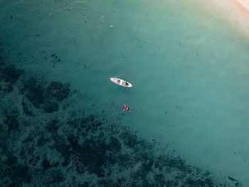 High angle view of people swimming in sea